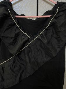Chic Black Ruffled Top with Pearl Detail