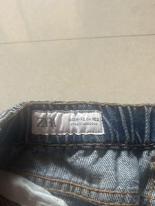 Distressed Blue Denim Jeans