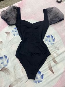 Chic Black Bodysuit with Sheer Puff Sleeves