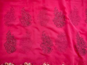 Rani Pink Embroidered Saree with stitched blouse