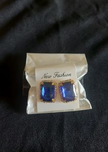 Classic Sapphire Earrings With Diamonds Around It