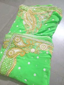 Vibrant Green Embroidered saree with stitched blou
