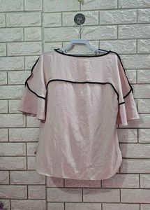 Calvin Klein Women's soft pink hue or light cream.