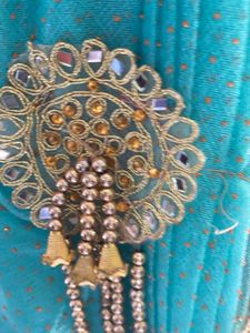 Stunning Blue and orange Net saree with Embellishm