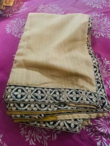 Elegant Beige Saree with Heavy Embellishment