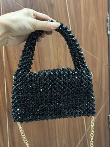 Hand made black pearls sling bag