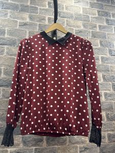 Chic Polka Dot Blouse with Lace Cuffs