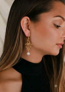 Elegant Gold Swirl Pearl Drop Earrings