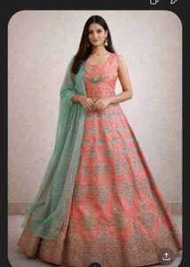 Ethnic peach gown with rich embroidery
