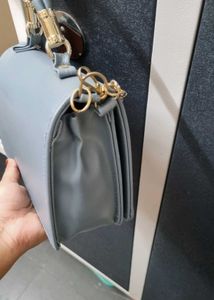 Stylish Light Blue Handbag with Gold Chain
