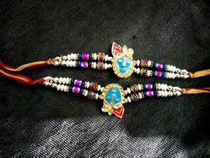 Elegant Rakhi with Red Pearls