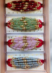 Elegant Red Beaded Rakhi 12 pc Set