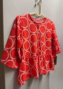 Vibrant Red Peplum Top with Circles