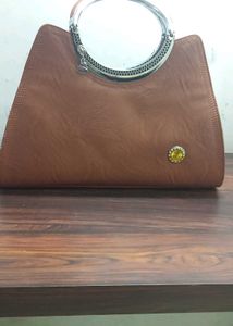 Chic Brown Handbag with Ring Handle