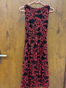 Black lacy dress with red floral detailing