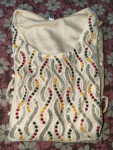 Embroidered Cream Kurta with Colorful Details