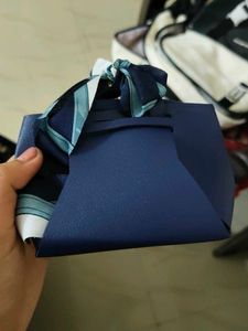 Chic Light Blue Handbag with Scarf Detail