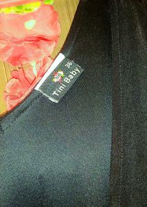 Black Mini Dress with Pink Embellishments