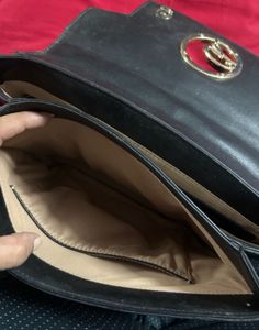 Chic Black Handbag with Gold G Logo