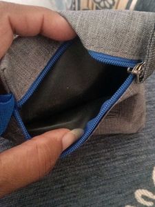 Gray zippered pouch with strap