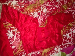 Net embroidery red saree with stitched blouse