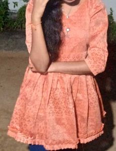 orange peplum Top