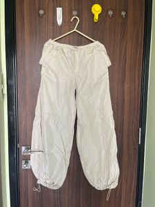 Beige parachute style trousers