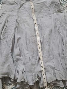 Light Blue Pleated Skirt with Button Detail