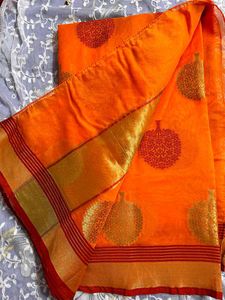 Vibrant Orange Saree with Leaf Motifs