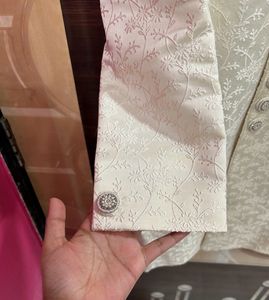 Men’s white sherwani with red velvet dhoti