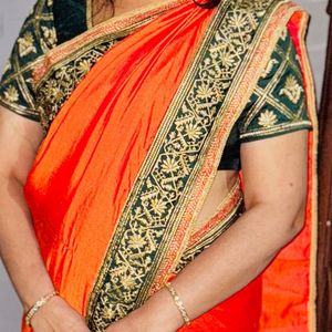 Elegant Orange Saree with Embellished Blouse