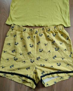 Only brand top with cute yellow shorts.