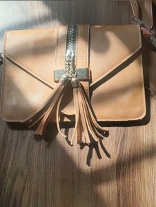 Stylish Tan Clutch with Tassels