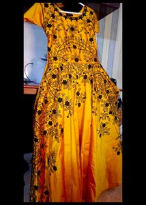 long yellow satin gown with black embroidery