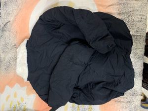 Black Puffer Jacket Had Adjustable Knot At The