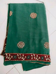 Green saree with contrast embroidered border...use