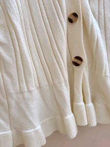 Cream Ribbed Cardigan with Ruffle Hem