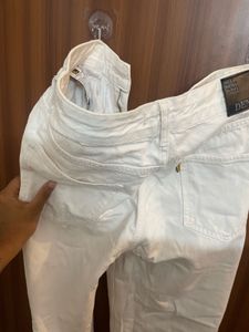 Cream Distressed Denim Jeans