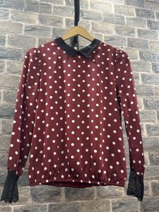 Chic Polka Dot Blouse with Lace Cuffs