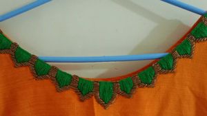 Vibrant Orange Kurta with Green Embroidery