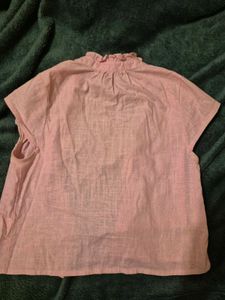 simple plain shirt with cute ruffle like style on