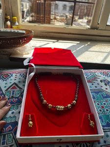 Elegant Beaded Necklace with Embellishments