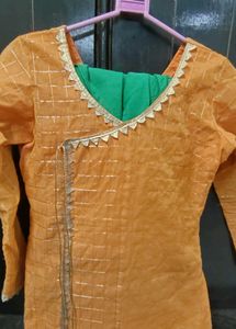 Orange kurta with golden border nakki lace