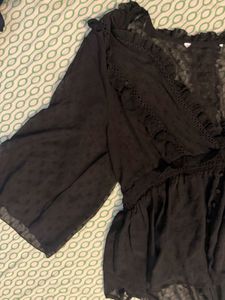Elegant Black Sheer Blouse with Ruffle Detail