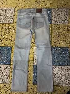 Light Wash Distressed Denim Jeans