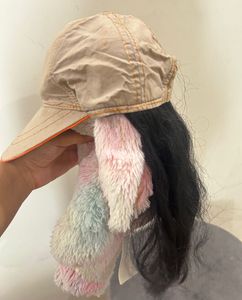 Cap with hair attached