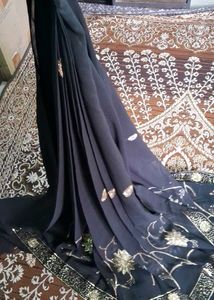 Elegant Black Saree with Gold Embellishments