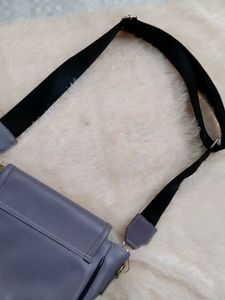 Stylish lavender crossbody bag with coin purse
