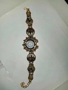 Exquisite Gold Tone Watch with Gemstones