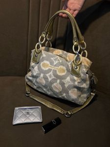 Chic Coach Shoulder Bag with Gold Accents